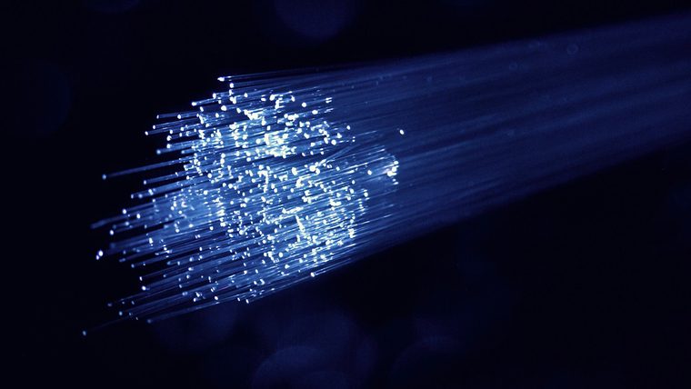 Characterising a steerable fibre under curvature